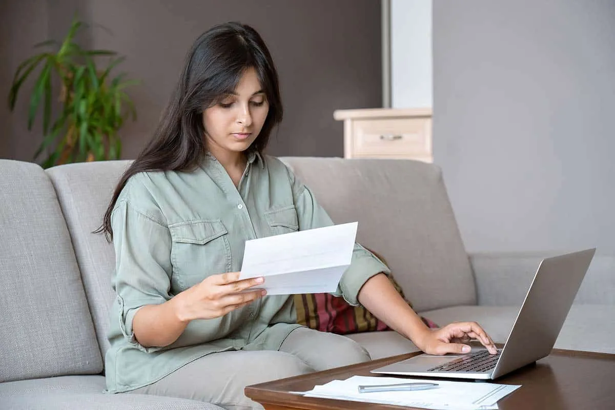 woman holding an IRS collections letter