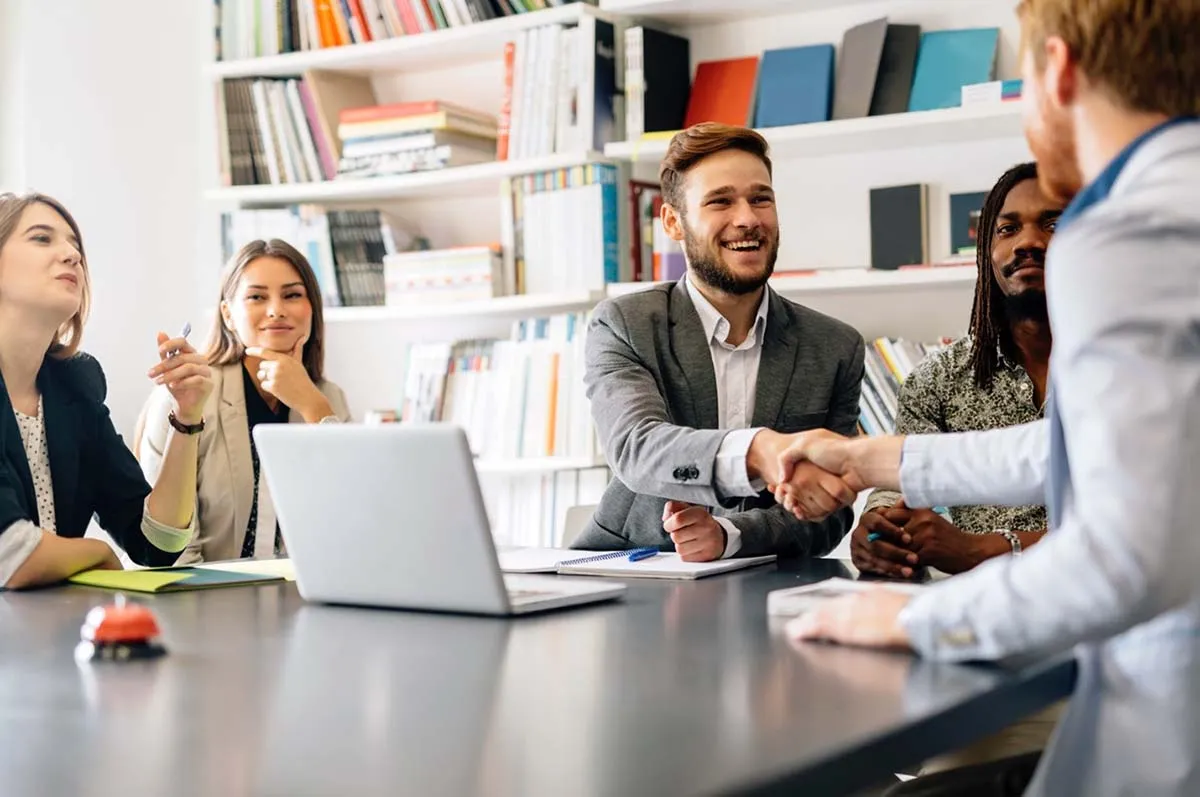 Attorneys Working with Client Around a Table