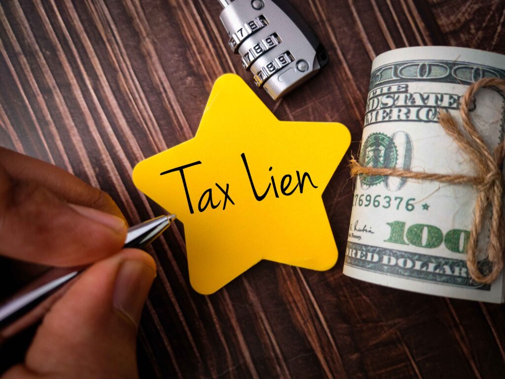 "Tax Lien" written on a yellow star. Is it time to hire a tax lien attorney for bac taxes?